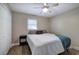 Cozy bedroom with a neutral palette, plush carpeting, and a large window for natural light at 3710 Lavilla Dr, Powder Springs, GA 30127
