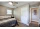 Bedroom with wood-style floors and neutral paint, showcasing ample natural light at 3710 Lavilla Dr, Powder Springs, GA 30127