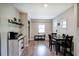 The dining area offers a charming space with a coffee bar and a classic dining set for Gathering meals at 3710 Lavilla Dr, Powder Springs, GA 30127