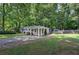 Inviting single-story home with a covered front porch and long driveway at 3710 Lavilla Dr, Powder Springs, GA 30127