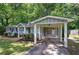 View of a home exterior with carport and lush green lawn at 3710 Lavilla Dr, Powder Springs, GA 30127