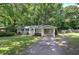 Charming single-story home with lovely curb appeal and a well-manicured front yard at 3710 Lavilla Dr, Powder Springs, GA 30127