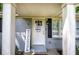 Close-up of front door with grey brick and welcome sign at 3710 Lavilla Dr, Powder Springs, GA 30127