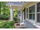 Charming home featuring a covered front porch and inviting landscaped garden at 3710 Lavilla Dr, Powder Springs, GA 30127