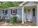 Charming exterior showcasing a covered front porch and lovely flower boxes at 3710 Lavilla Dr, Powder Springs, GA 30127