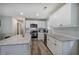 Well-lit kitchen featuring stainless appliances, white cabinets, subway backsplash and granite countertops at 3710 Lavilla Dr, Powder Springs, GA 30127