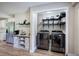 Well-organized laundry room features modern washer and dryer, storage, and decor at 3710 Lavilla Dr, Powder Springs, GA 30127