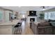 Spacious living room with an open-concept design, seamlessly connecting to the modern kitchen at 3710 Lavilla Dr, Powder Springs, GA 30127