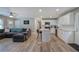 Open-concept living area boasts new floors, recessed lighting, and seamless flow from the kitchen to living room at 3710 Lavilla Dr, Powder Springs, GA 30127