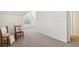 Hallway with neutral carpet, white walls and view of the bedroom at 4585 Lakefield Bnd, Berkeley Lake, GA 30096