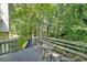 Relax on the back deck with wooded views, perfect for outdoor entertaining or enjoying nature at 4739 Bradford Ln, Powder Springs, GA 30127