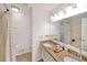 Bathroom featuring double vanity, tile floor, and shower with tub at 4739 Bradford Ln, Powder Springs, GA 30127