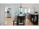 Bright dining area with wood table and chairs, adjacent to the kitchen and backyard access at 4739 Bradford Ln, Powder Springs, GA 30127