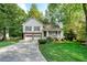 Inviting two-story home with a lovely front porch, two-car garage, and a lush green lawn at 4739 Bradford Ln, Powder Springs, GA 30127