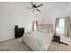 Relaxing main bedroom features neutral tones, plush carpet, a ceiling fan and natural light at 4739 Bradford Ln, Powder Springs, GA 30127