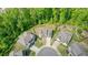 Aerial view of property situated in a quiet cul-de-sac surrounded by lush trees at 242 Fieldbrook Xing, Canton, GA 30115