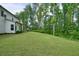 Expansive backyard surrounded by mature trees at 242 Fieldbrook Xing, Canton, GA 30115
