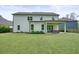 Large backyard features a covered patio with seating area at 242 Fieldbrook Xing, Canton, GA 30115