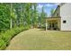 Large backyard featuring mature trees and lush greenery at 242 Fieldbrook Xing, Canton, GA 30115