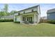 Well-maintained backyard with covered patio and outdoor seating at 242 Fieldbrook Xing, Canton, GA 30115