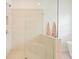 Bright bathroom featuring a glass shower with built in seat at 242 Fieldbrook Xing, Canton, GA 30115