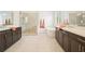 Bright bathroom featuring a soaking tub, separate shower, and double vanity with dark wood cabinets at 242 Fieldbrook Xing, Canton, GA 30115