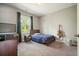 Cozy bedroom with neutral walls, carpet, and a large window with backyard views at 242 Fieldbrook Xing, Canton, GA 30115
