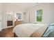 Serene bedroom with ensuite bathroom, dresser, and a calming view from the window at 242 Fieldbrook Xing, Canton, GA 30115