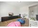 Bonus room with wood floors, pink and blue beanbags, and a full media center at 242 Fieldbrook Xing, Canton, GA 30115