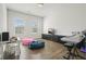 Bonus room with wood floors, pink and blue beanbags, and a media center at 242 Fieldbrook Xing, Canton, GA 30115