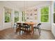 Charming dining room with natural light and backyard views, perfect for Gathering meals at 242 Fieldbrook Xing, Canton, GA 30115