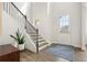 Bright foyer with a staircase and a view of the home's entry at 242 Fieldbrook Xing, Canton, GA 30115