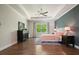 Bright main bedroom with tray ceiling and large window offering natural light at 242 Fieldbrook Xing, Canton, GA 30115