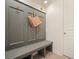 Convenient mudroom with bench, storage hooks, and access to the outdoors at 242 Fieldbrook Xing, Canton, GA 30115