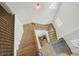 Wide staircase featuring wooden steps and railings, connecting multiple levels of the home at 242 Fieldbrook Xing, Canton, GA 30115