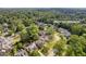Aerial view of neighborhood featuring lush greenery and the home at 2853 N Thompson Rd NE at 2853 N Thompson Ne Rd, Brookhaven, GA 30319