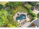 Aerial view showcasing a backyard with a pool, spa, lounge areas, and lush landscaping at 2853 N Thompson Ne Rd, Brookhaven, GA 30319