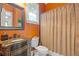This bathroom includes granite countertops and a shower and bath combination at 2853 N Thompson Ne Rd, Brookhaven, GA 30319