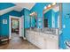 Bathroom with dual vanities and plenty of cabinet space with a walk-in closet nearby at 2853 N Thompson Ne Rd, Brookhaven, GA 30319
