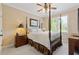 Comfortable bedroom with a four-poster bed, ceiling fan, and soft lighting, creating a relaxing atmosphere at 2853 N Thompson Ne Rd, Brookhaven, GA 30319