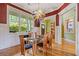 Elegant dining room with a large window offering a view of the lush greenery outside at 2853 N Thompson Ne Rd, Brookhaven, GA 30319