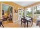 The dining room has large windows that offer natural light and views of the patio and outdoor living space at 2853 N Thompson Ne Rd, Brookhaven, GA 30319