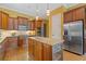 A view of the spacious kitchen featuring custom cabinets, stainless steel appliances, and a granite island at 2853 N Thompson Ne Rd, Brookhaven, GA 30319
