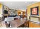 Open floor plan with an eat-in dining area, custom built-in shelving, fireplace, and updated kitchen at 2853 N Thompson Ne Rd, Brookhaven, GA 30319