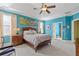 Spacious main bedroom boasts large windows, tray ceiling, ceiling fan, and ensuite bathroom at 2853 N Thompson Ne Rd, Brookhaven, GA 30319