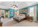 Spacious main bedroom boasts large windows, tray ceiling, ceiling fan, and ensuite bathroom at 2853 N Thompson Ne Rd, Brookhaven, GA 30319