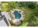 Aerial view of a backyard with a freeform pool, hot tub, and lush landscaping at 2853 N Thompson Ne Rd, Brookhaven, GA 30319