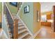 A classic staircase with wood railing and iron spindles leads to the upper level of the home at 2853 N Thompson Ne Rd, Brookhaven, GA 30319