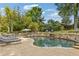 Stunning backyard featuring a freeform pool, stone accents, lounge seating, and lush greenery at 2853 N Thompson Ne Rd, Brookhaven, GA 30319