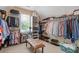 Spacious walk-in closet with custom shelving, hanging rods, and organized storage for clothing and accessories at 2853 N Thompson Ne Rd, Brookhaven, GA 30319